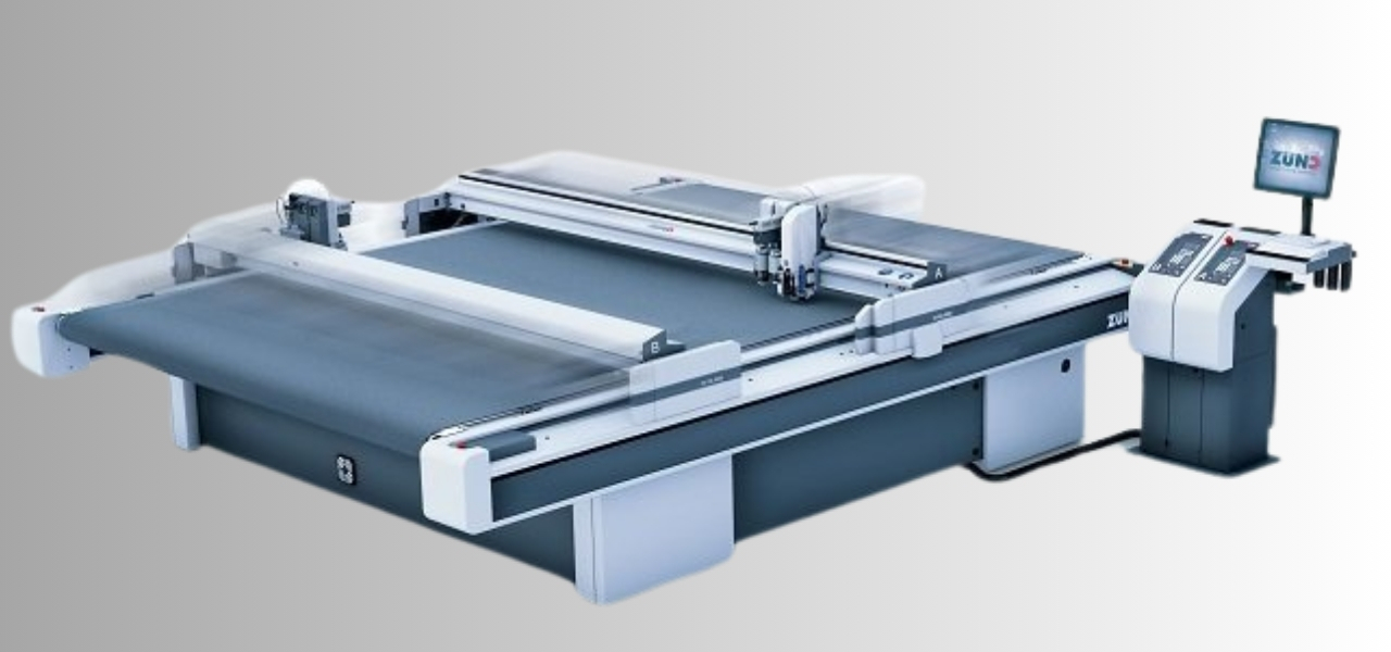 Zünd Swiss cutting system machine in a production environment, showcasing advanced cutting technology for precise finishing.