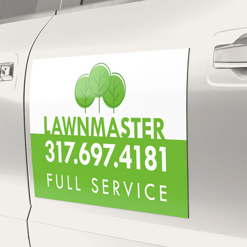 A large custom printed magnet on a car door, showcasing vibrant graphics and branding.