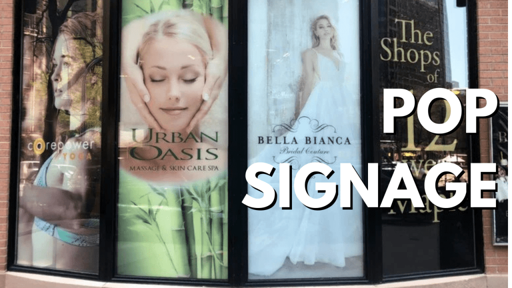 Eye-catching custom POP window signage for storefront promotions.