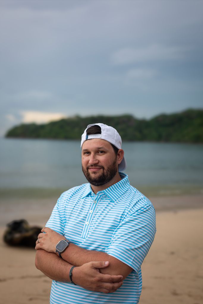 Logan Watson, production manager at VistaCraft, overseeing the printing process with a focused expression.