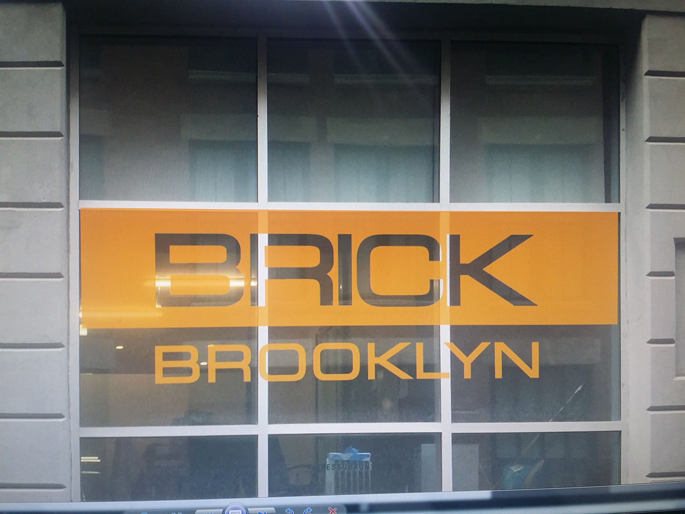 Colorful promotional window cling signage for storefronts