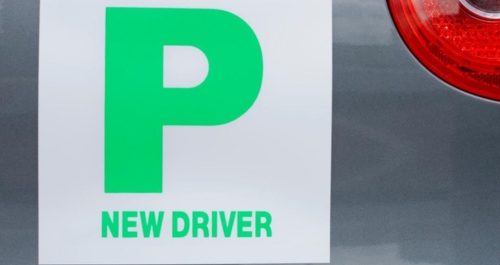 Custom printed magnet displayed on the side of a car, featuring a company logo and branding.
