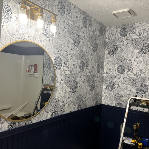 A stylish room featuring custom printed wallpaper with vibrant patterns and textures.